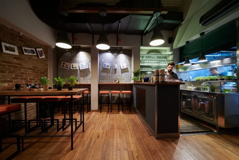 KAI dining room with the bar and open kitchen