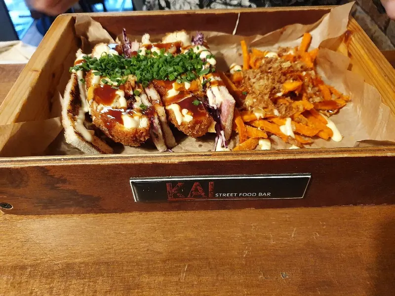 Katsu sando and sweet potato fries on a KAI wooden tray
